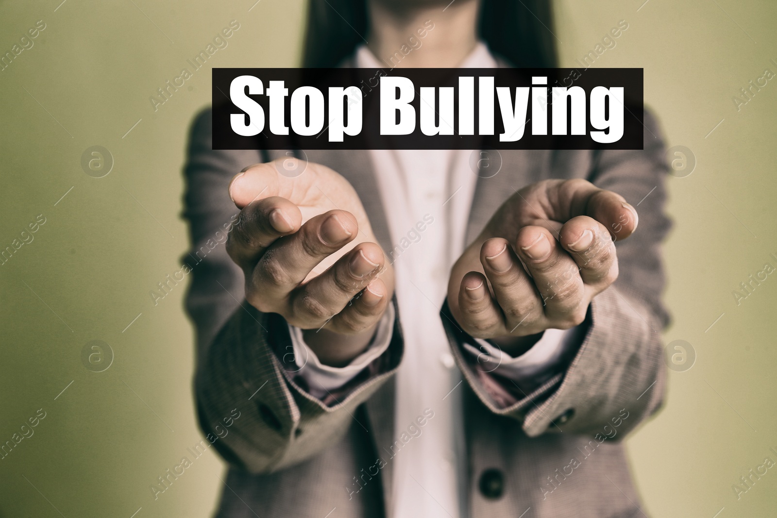 Image of Young woman showing sign STOP BULLYING on color background, closeup 