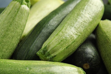 Photo of Fresh ripe green zucchini as background, closeup