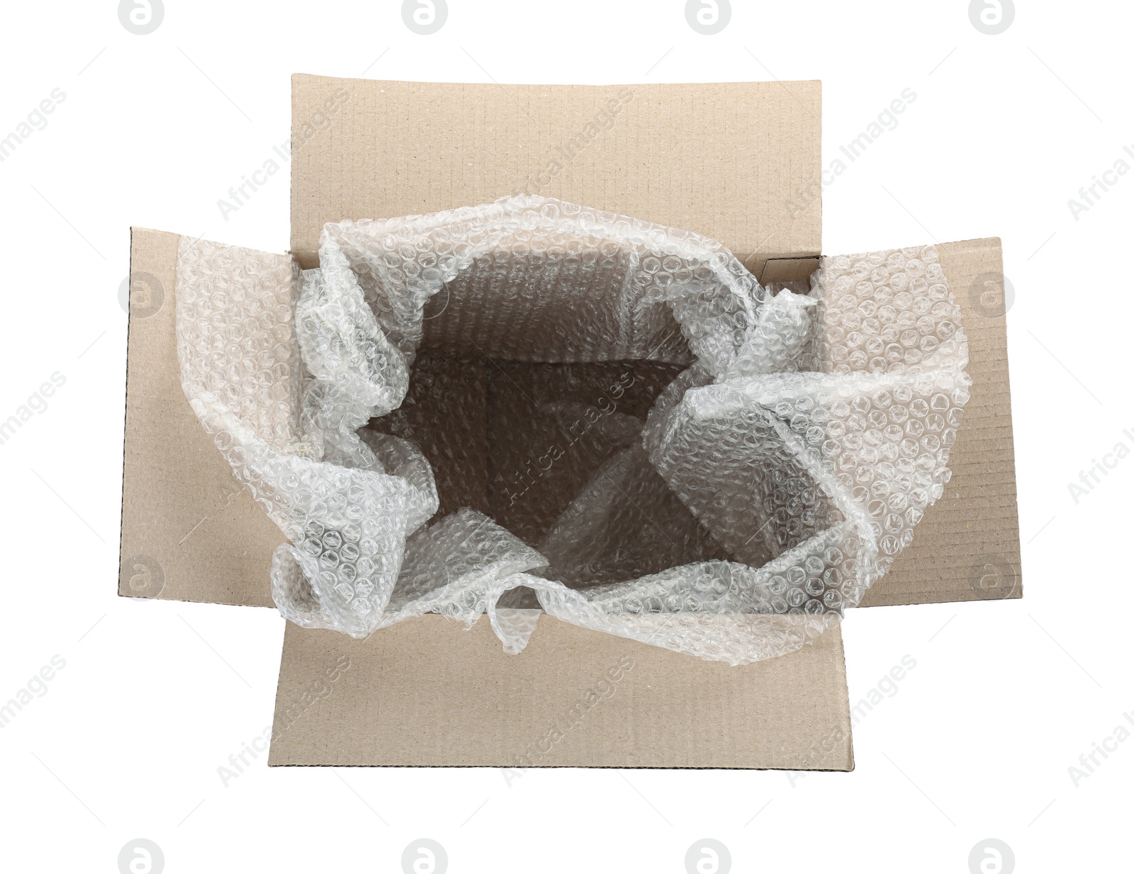 Photo of Transparent bubble wrap in cardboard box isolated on white, top view