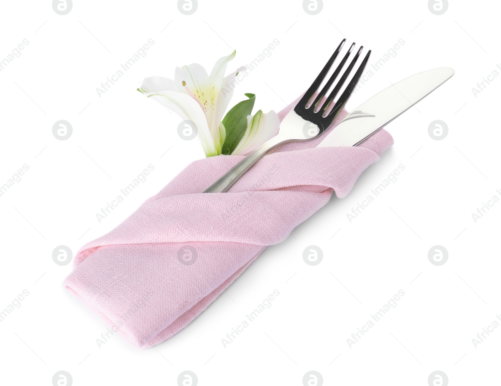 Photo of Folded napkin with fork, knife and flower on white background