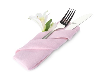 Photo of Folded napkin with fork, knife and flower on white background