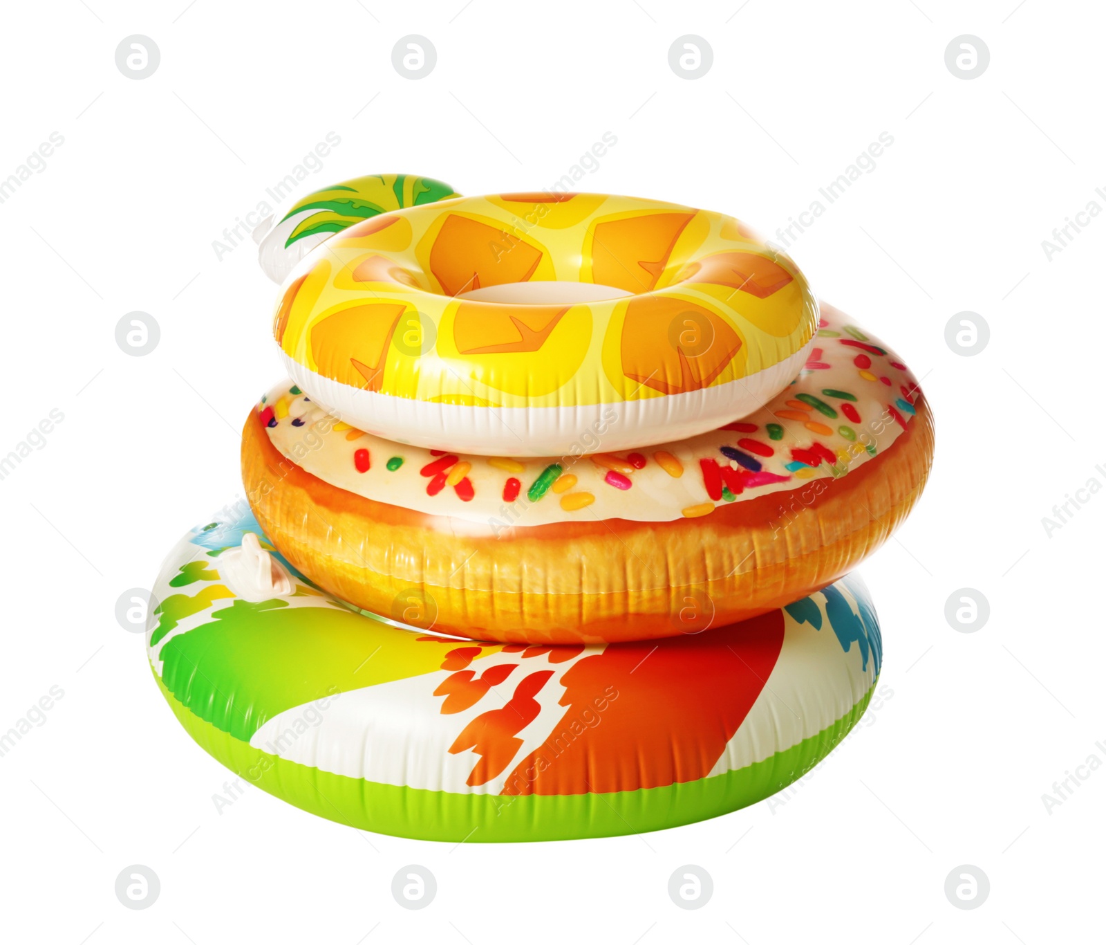 Photo of Different bright inflatable rings on white background. Summer holidays