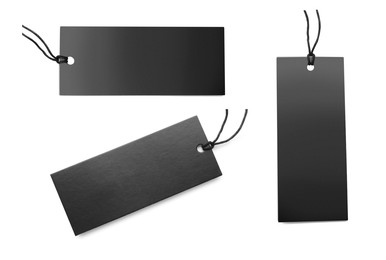 Set with black cardboard tags on white background, top view. Space for text