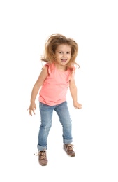 Pretty little girl jumping against white background