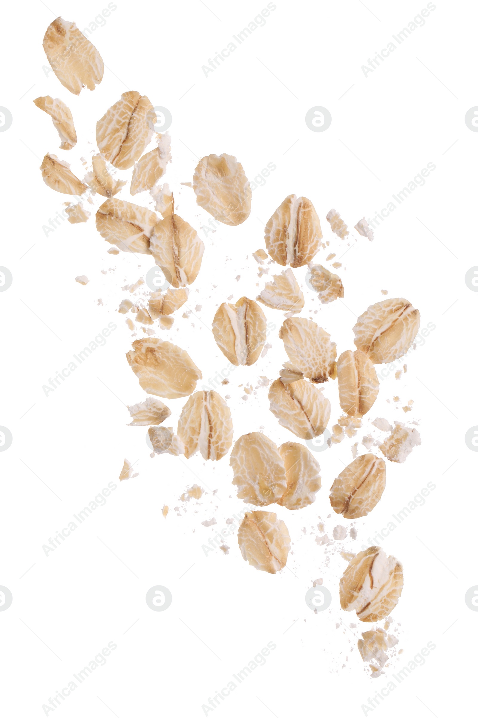 Photo of Dry oat flakes falling on white background