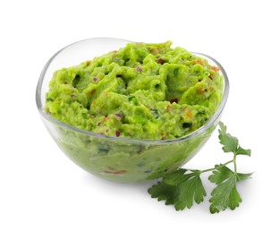 Photo of Bowl of delicious guacamole with parsley isolated on white