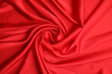 Photo of Texture of delicate red silk as background, top view