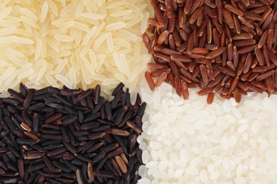 Photo of Different sorts of rice as background, top view