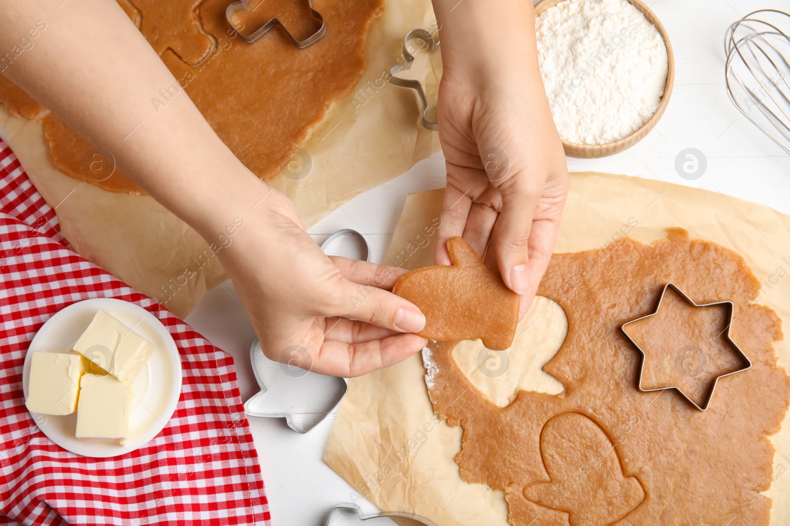 Photo of Woman making Christmas cookies at table, closeup