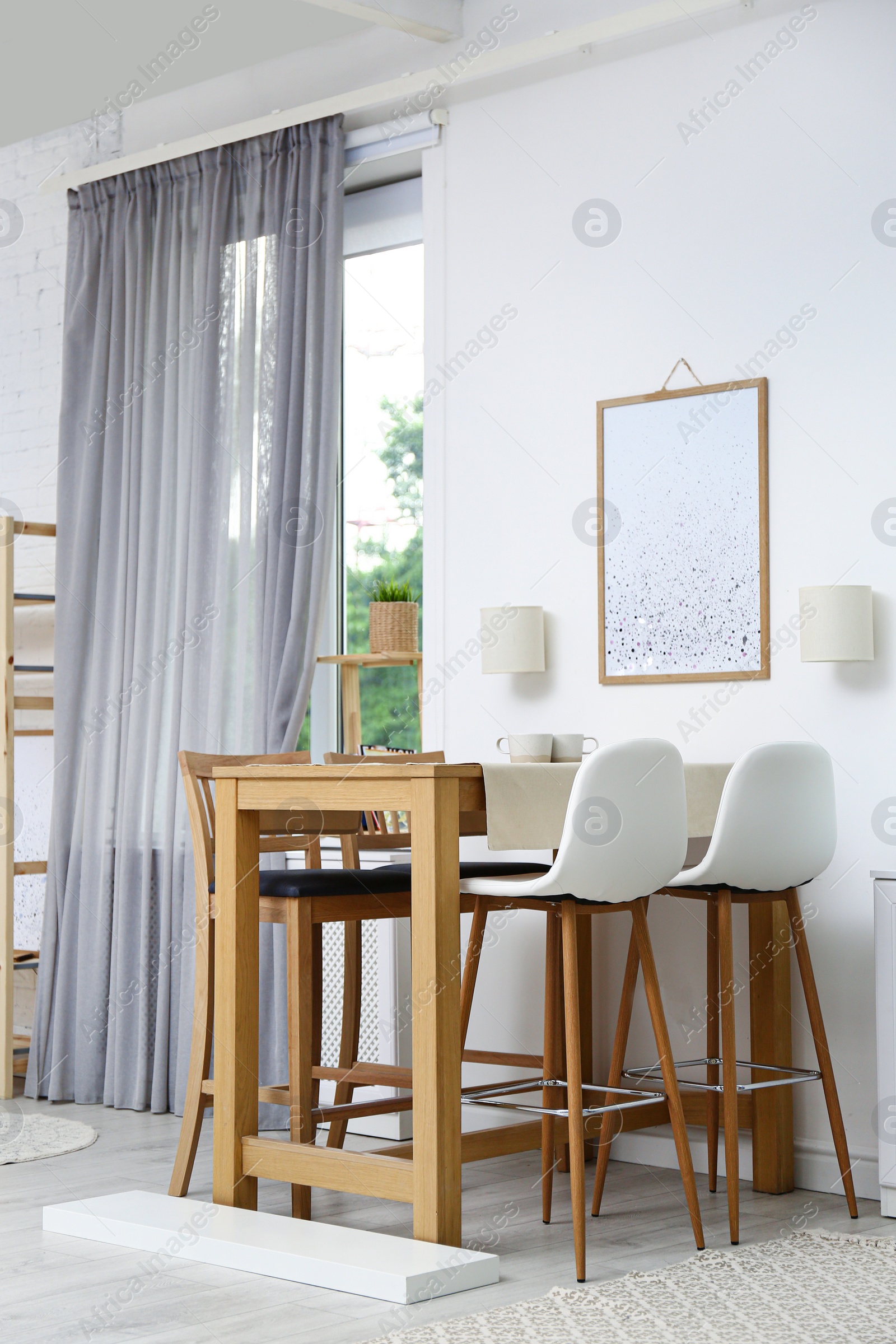 Photo of Modern room interior with wooden dining table