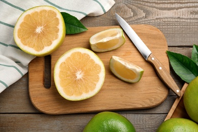 Flat lay composition with sweetie fruits on wooden table