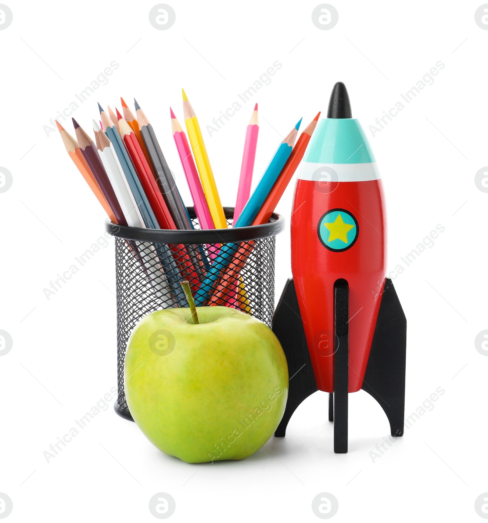 Photo of Bright toy rocket, apple and pencils on white background