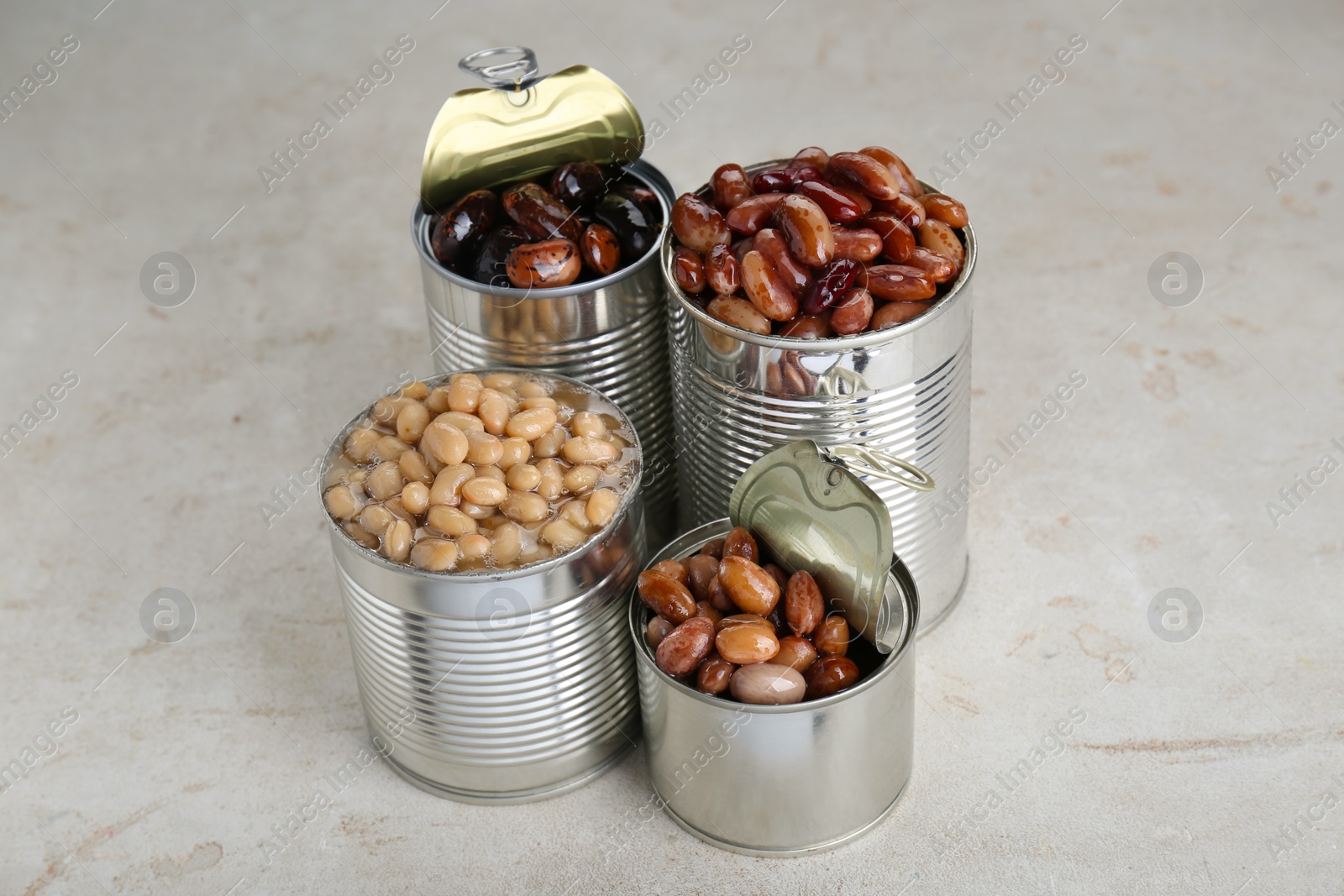 Photo of Tin cans with kidney beans on light table