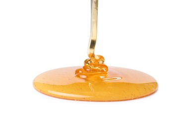 Photo of Pouring tasty natural honey isolated on white