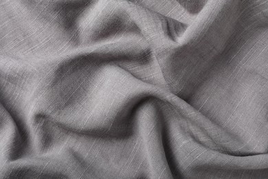 Photo of Grey hemp cloth as background, top view. Natural fabric