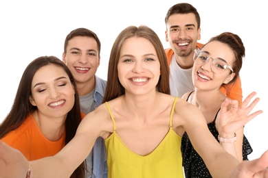 Young happy friends taking selfie against white background