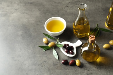 Photo of Composition with fresh olive oil on grey background