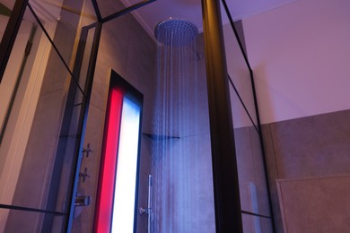 Photo of Modern shower with Infrared spectrum, UV light and flowing water