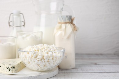 Different fresh dairy products on white wooden table