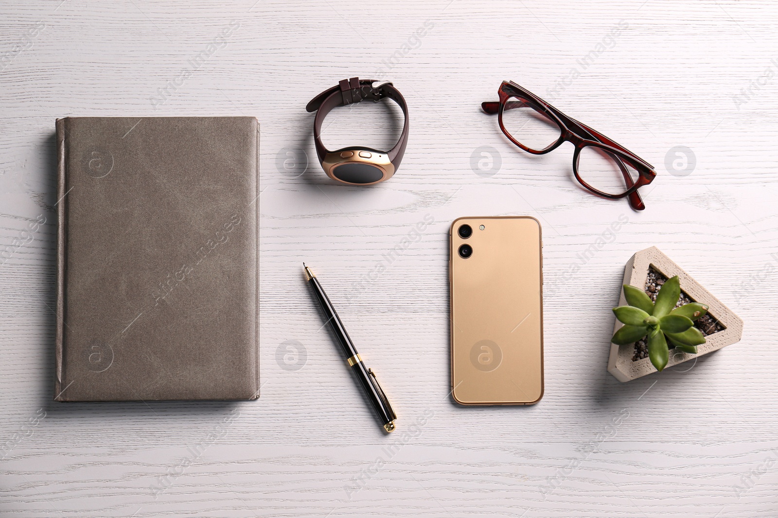 Flat lay composition with stylish smart watch on white wooden table Photo of Flat lay composition with stylish smart watch on white wooden table