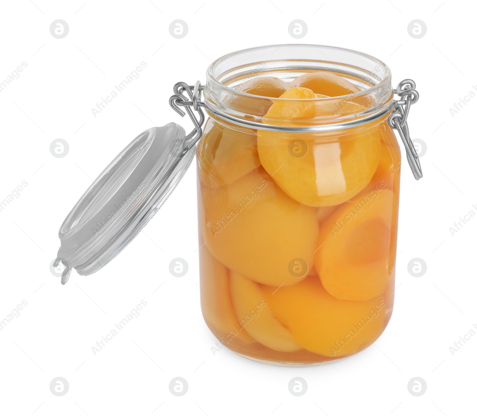 Photo of Glass jar with canned peach halves isolated on white