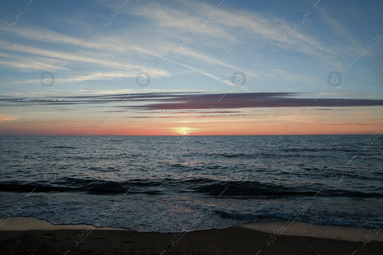 Photo of Picturesque view of sea at sunset. Tropical beach