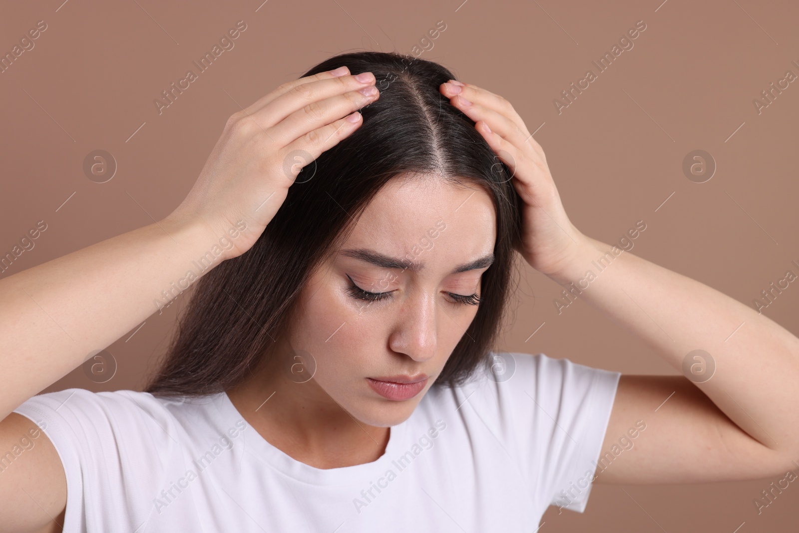 Photo of Woman with healthy hair on beige background