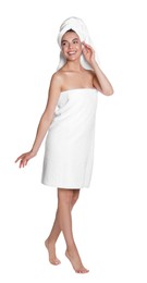Photo of Beautiful young woman with towels on white background