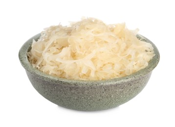 Photo of Bowl of tasty fermented cabbage isolated on white