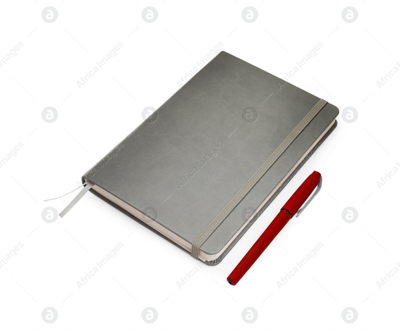 Photo of Closed grey notebook with pen isolated on white