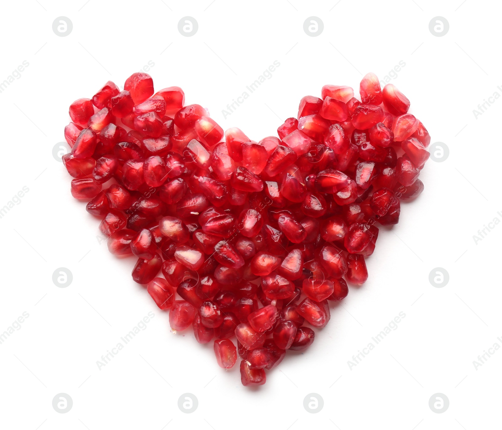 Photo of Heart made of pomegranate seeds on white background, top view