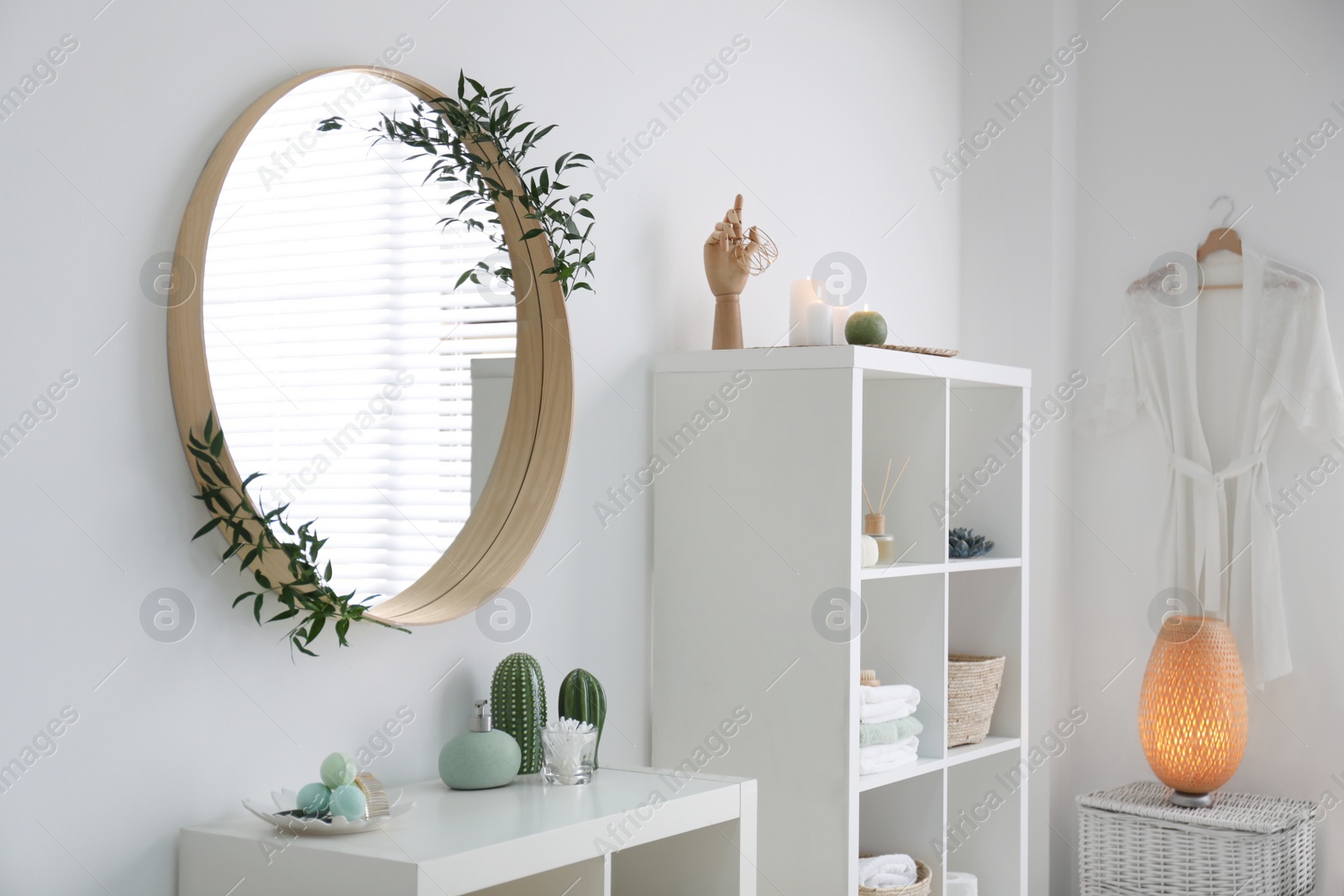 Photo of Elegant modern bathroom with mirror on white wall