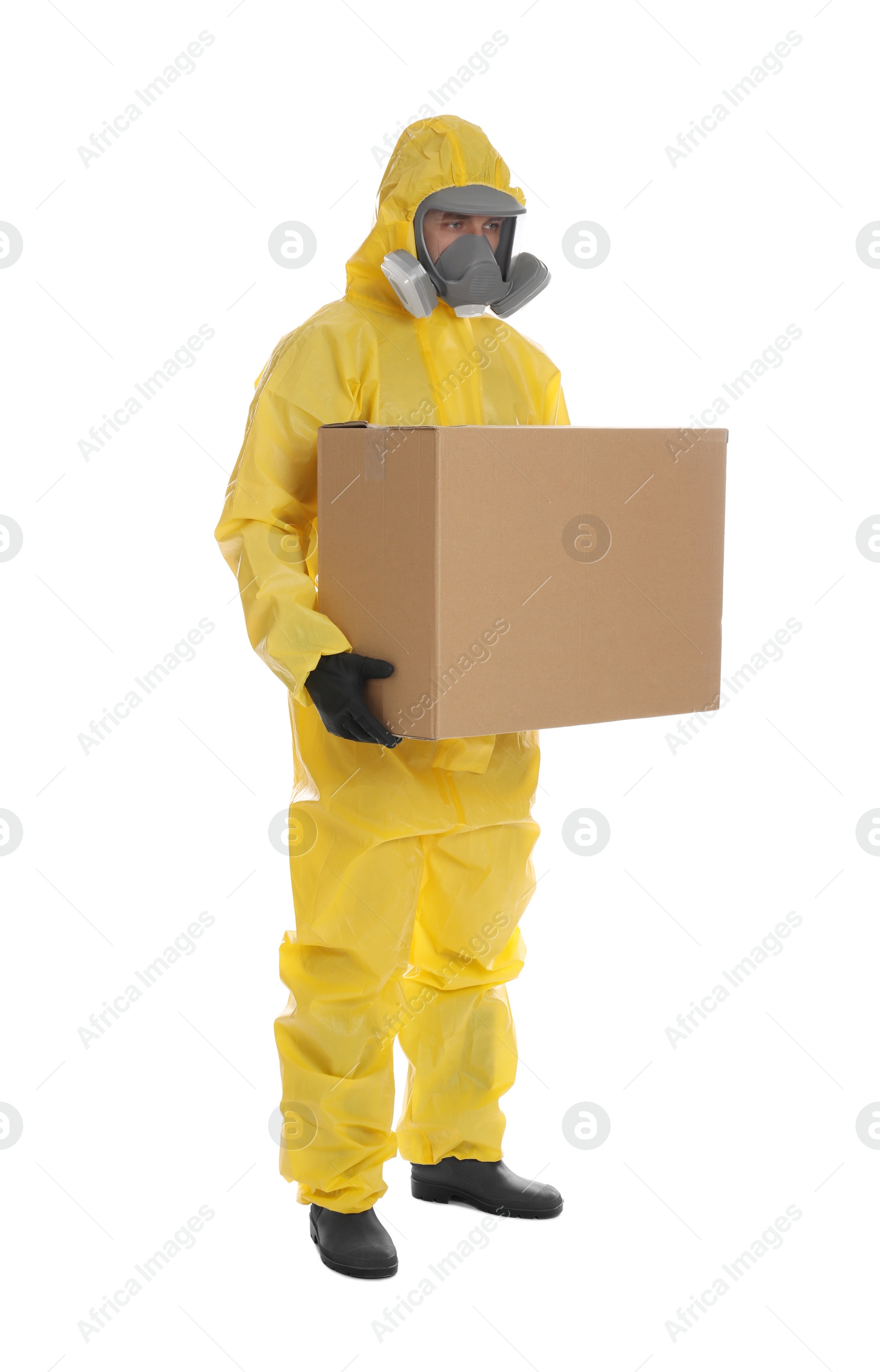 Photo of Man wearing chemical protective suit with cardboard box on white background. Prevention of virus spread