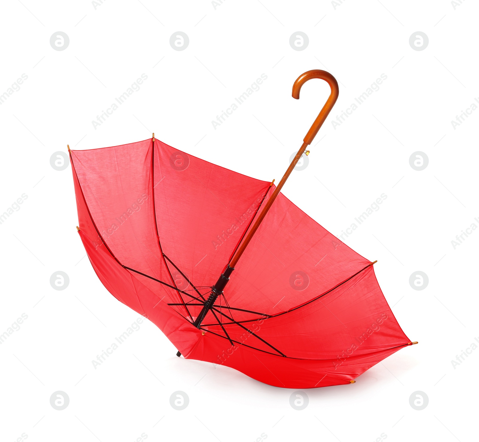 Photo of Modern opened red umbrella isolated on white