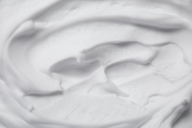 Texture of white shaving foam as background, top view