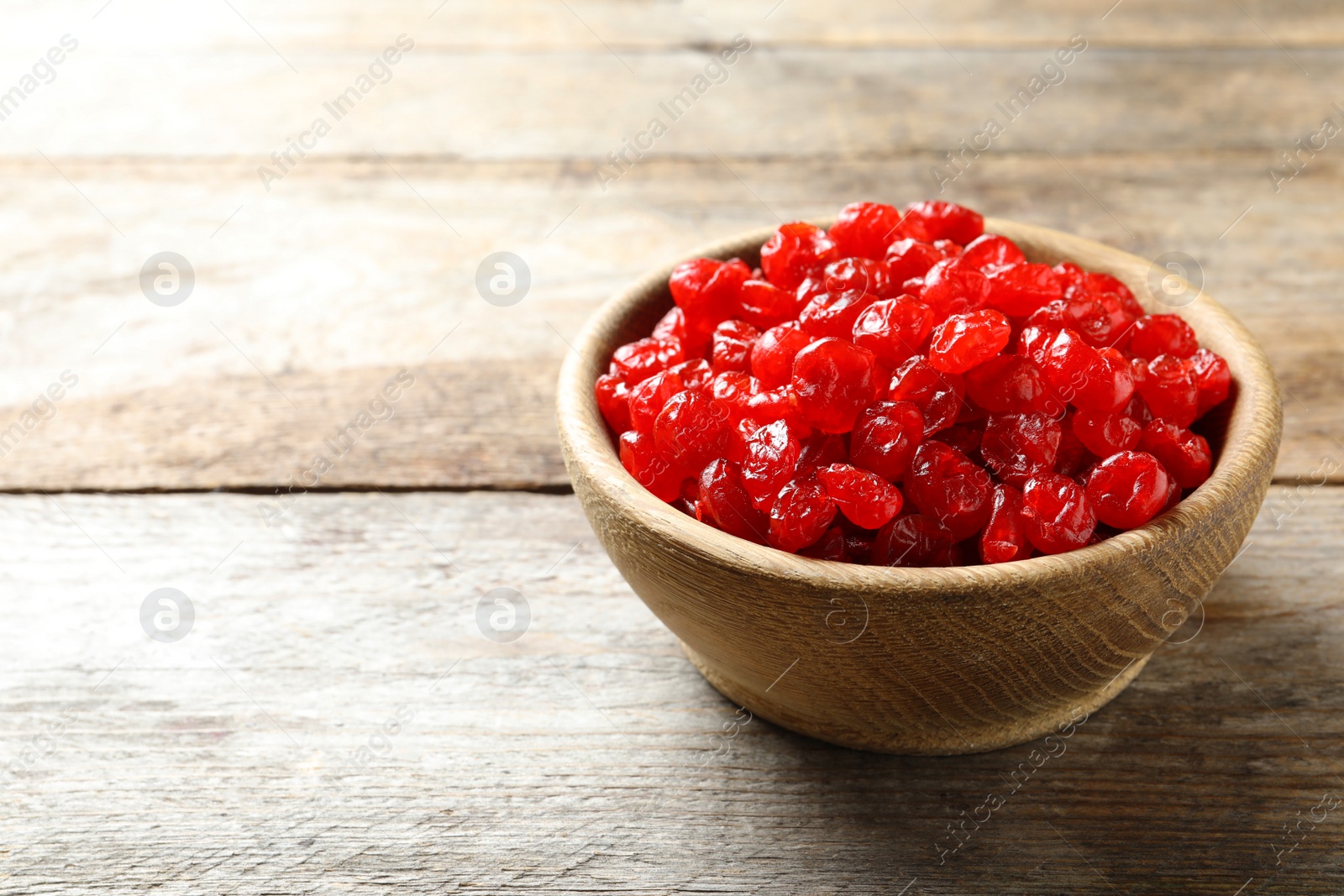 Photo of Bowl of sweet cherries on table, space for text. Dried fruit as healthy snack