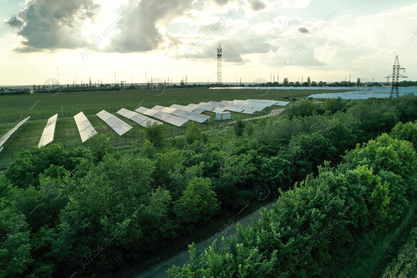 Photo of Solar panels installed outdoors, aerial view. Alternative energy source