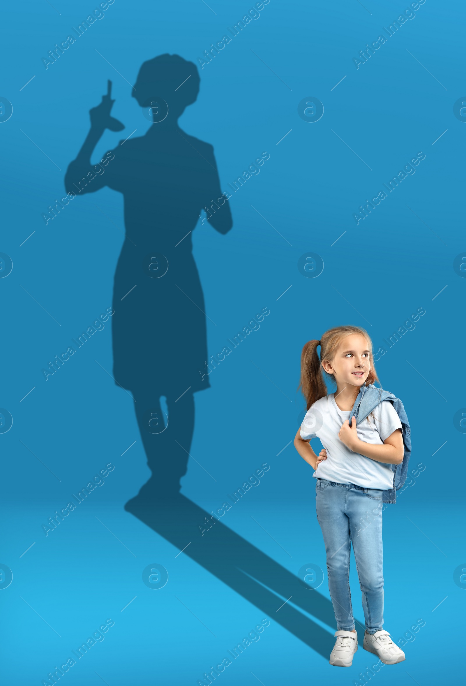 Image of Dream about future occupation. Smiling girl and silhouette of chef on blue background
