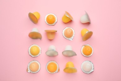Photo of Tasty bright jelly cups on pink background, flat lay