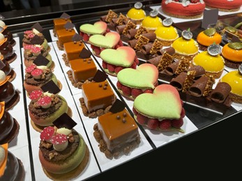 Photo of Showcase with different tasty desserts in store