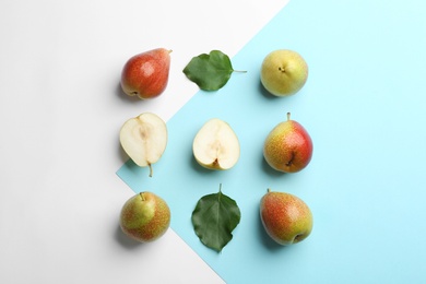 Photo of Ripe juicy pears on color background, flat lay