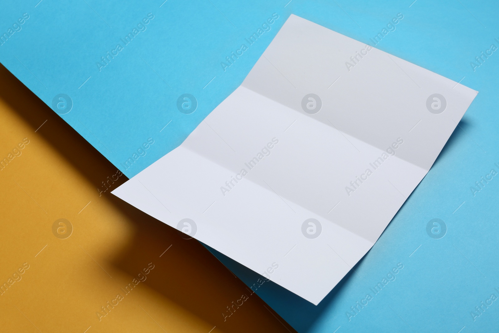 Photo of Empty flyer on color background. Mockup for design