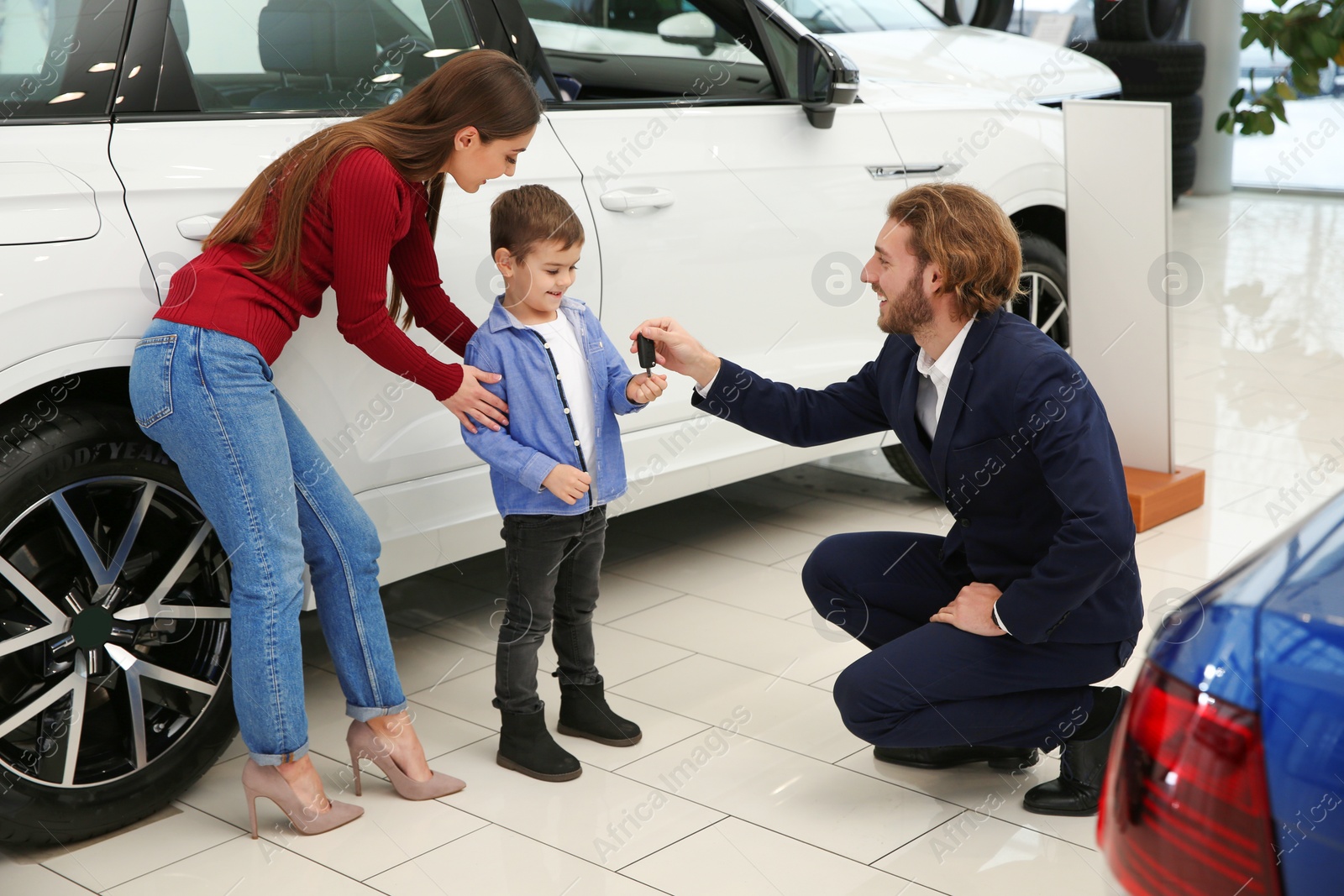 Photo of Car salesman working with family in dealership