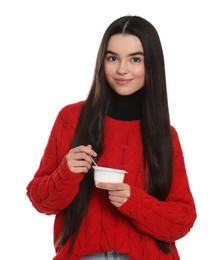 Photo of Happy teenage girl with delicious yogurt and spoon on white background