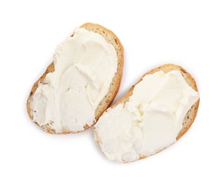 Bread with cream cheese on white background, top view