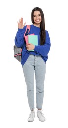 Photo of Teenage girl with backpack and textbooks on white background