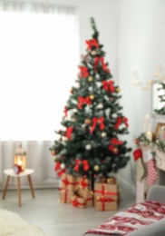 Photo of Blurred view of stylish living room interior with decorated Christmas tree