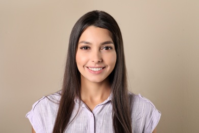 Photo of Young woman with healthy teeth on color background