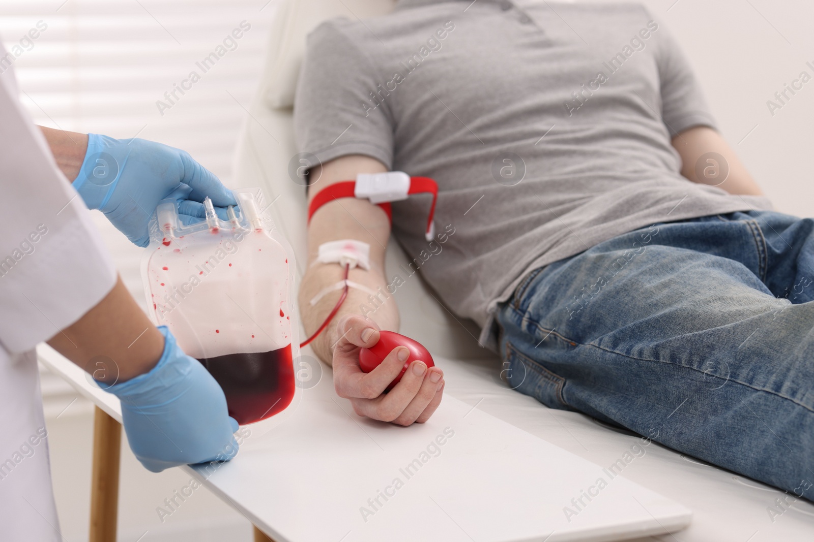 Photo of Patient undergoing blood transfusion in hospital, closeup