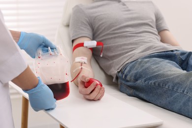 Patient undergoing blood transfusion in hospital, closeup